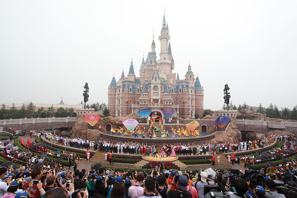 SHANGHAI, CHINA - JUNE 16: Tourists watch the opening ceremony at Shanghai Disney Resort on June 16, 2016 in Shanghai, China. Shanghai Disney Resort held the opening ceremony and welcomed tourists on Thursday. (Photo by Visual China/Getty Images)